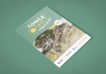 brochure van de zomerfietszoektocht op een groene achtergrond